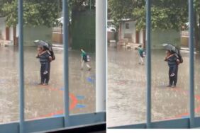 Yürek ısıtan görüntüler... Sağanak altında torunuyla İstiklal Marşı'nı dinledi