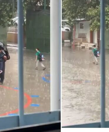 Yürek ısıtan görüntüler... Sağanak altında torunuyla İstiklal Marşı'nı dinledi